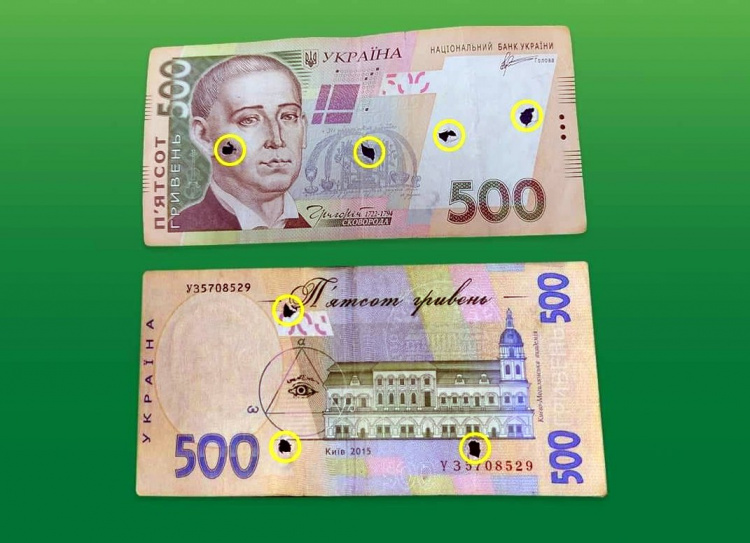 В Україні масово поширюють пошкоджені купюри 500 гривень:як не потрапити на фальшивку